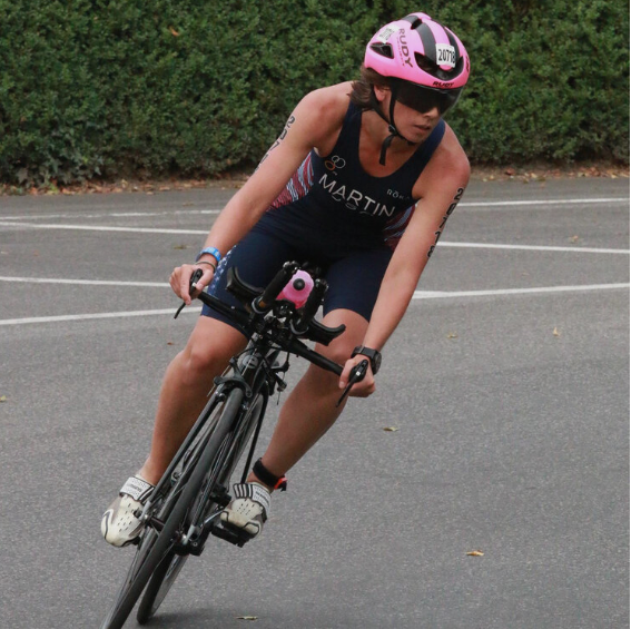 Fiona Fiona on her bike witha pink helmet on