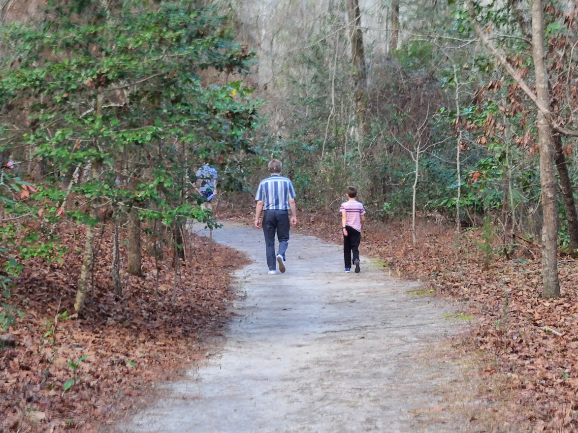 HIkeTrailfathersonGoodale A Father and son walking a wide path at Goodale Sate Park Nature Trail