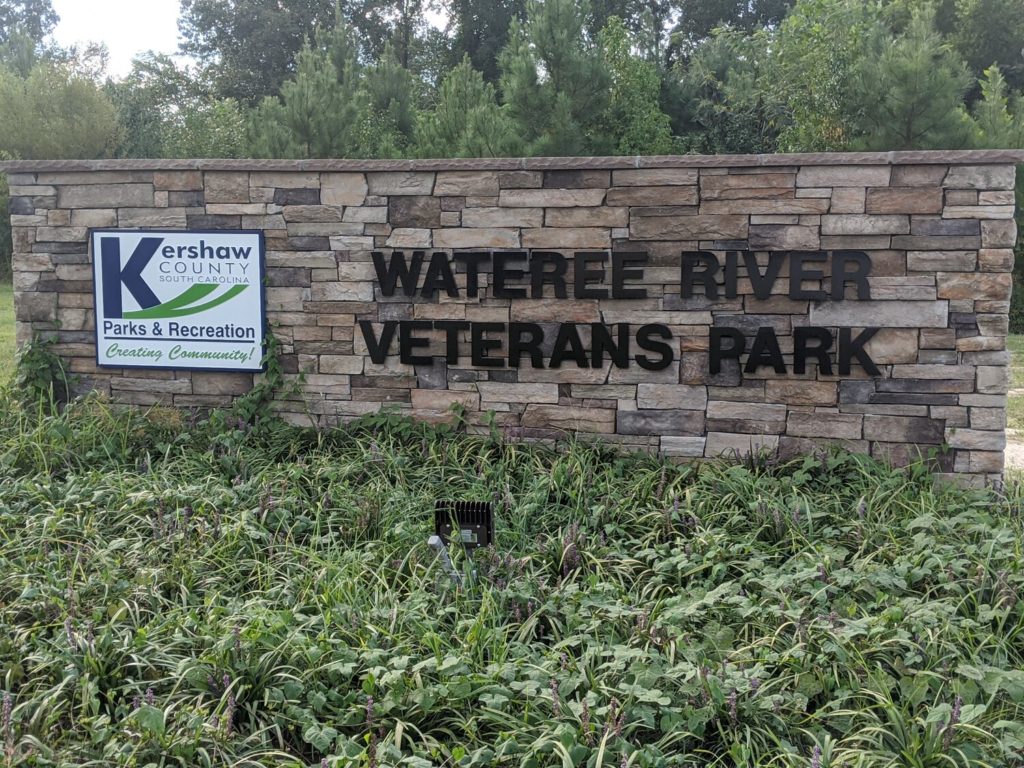 Wateree River Veterans Park signage with Kerhaw County Parks and Recreations emblem on it.