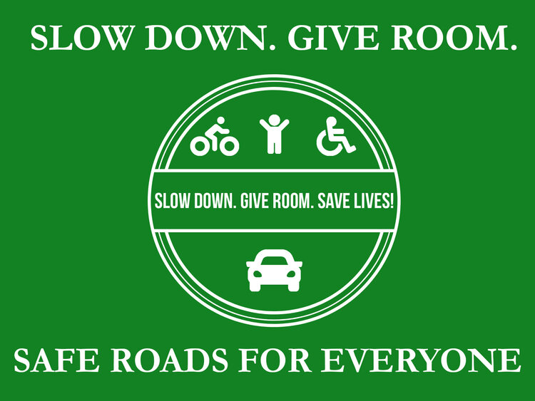 Poster That Says Slow Down, Give Room, Safe Roads For Everyone